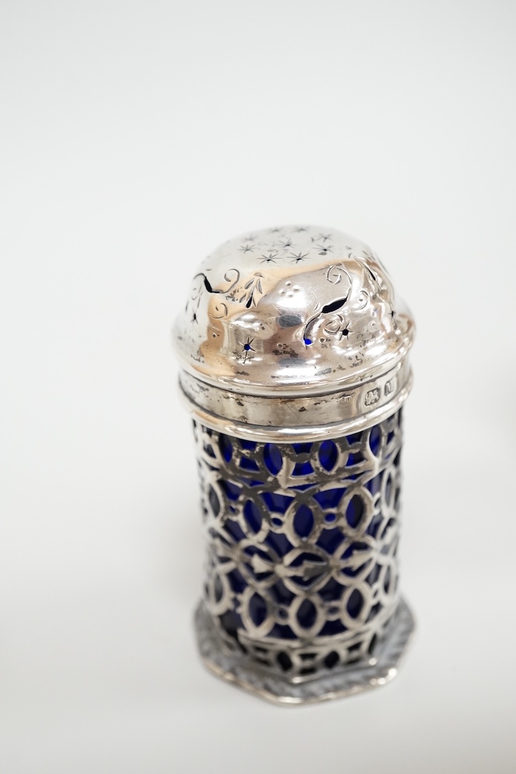 Four assorted silver condiments including a Victorian bun salt and a late Victorian pepper mill, together with a small silver bowl, a silver matchbox sleeve and a small silver two handled cup.
